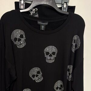 Cynthia Rowley Black Top with Skull Accents paired with leggings